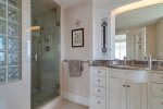 Master en suite bathroom with double sink vanity and custom glass shower